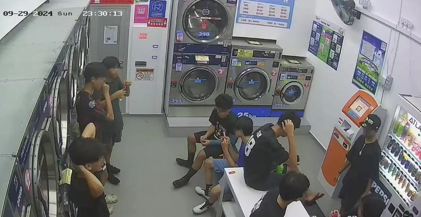 Teens caught on CCTV monkeying around at laundromat, leaving behind trash